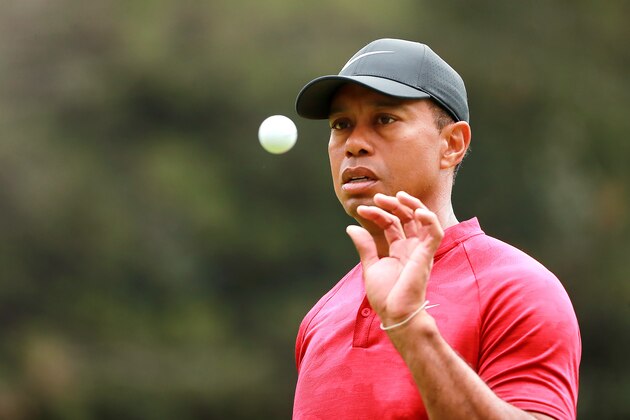 MEXICO CITY, MEXICO - FEBRUARY 24: Tiger Woods of the United States catches a ball on the 12th green during the final round of World Golf Championships-Mexico Championship at Club de Golf Chapultepec on February 24, 2019 in Mexico City, Mexico. (Photo by Hector Vivas/Getty Images)