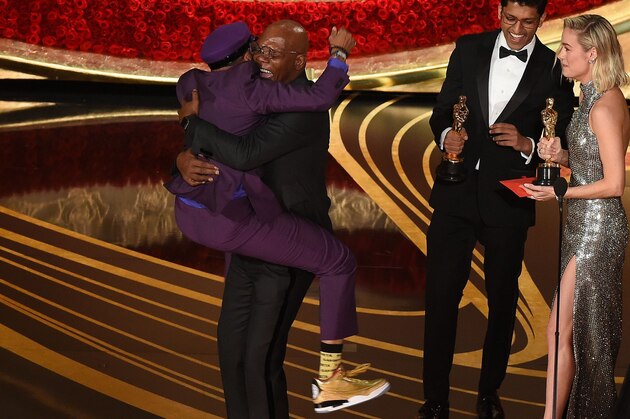 Best Adapted Screenplay nominee for 'BlacKkKlansman' Spike Lee (L) jumps in the arms of Actor Samuel L. Jackson as he accepts the award for Best Original Screenplay during the 91st Annual Academy Awards at the Dolby Theatre in Hollywood, California on February 24, 2019. (Photo by VALERIE MACON / AFP)        (Photo credit should read VALERIE MACON/AFP/Getty Images)