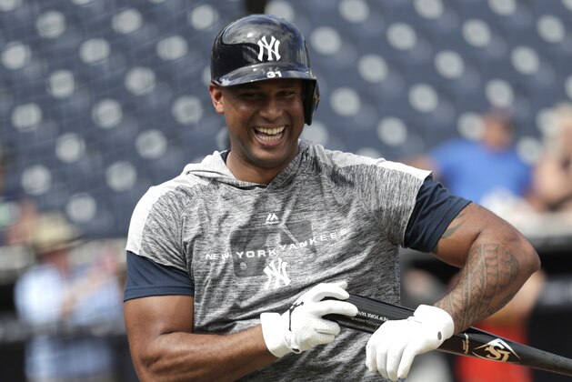 New York Yankees' Aaron Hicks smiles after taking batting practice at the Yankees spring training baseball facility, Thursday, Feb. 21, 2019, in Tampa, Fla. (AP Photo/Lynne Sladky)