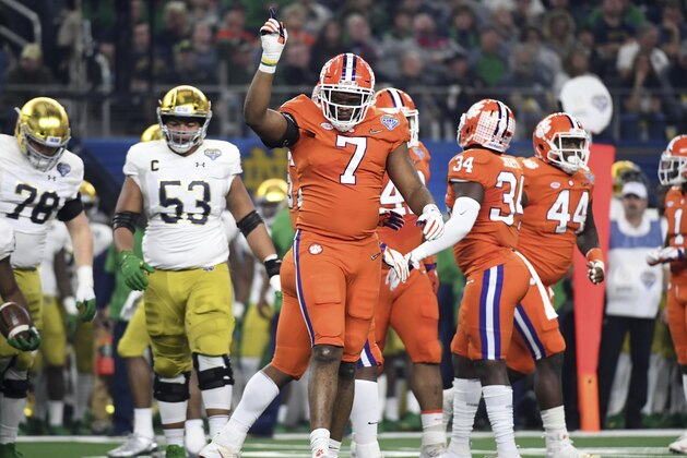 Clemson defensive end Austin Bryant (7) celebrates a stop again Notre Dame during the NCAA Cotton Bowl semi-final playoff football game, Saturday, Dec. 29, 2018, in Arlington, Texas. (AP Photo/ Jeffrey McWhorter)