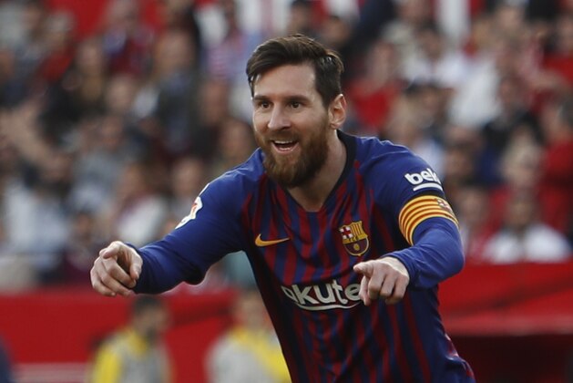 Barcelona forward Lionel Messi celebrates after scoring his side's second goal during La Liga soccer match between Sevilla and Barcelona at the Ramon Sanchez Pizjuan stadium in Seville, Spain. Saturday, February 23, 2019. (AP Photo/Miguel Morenatti)