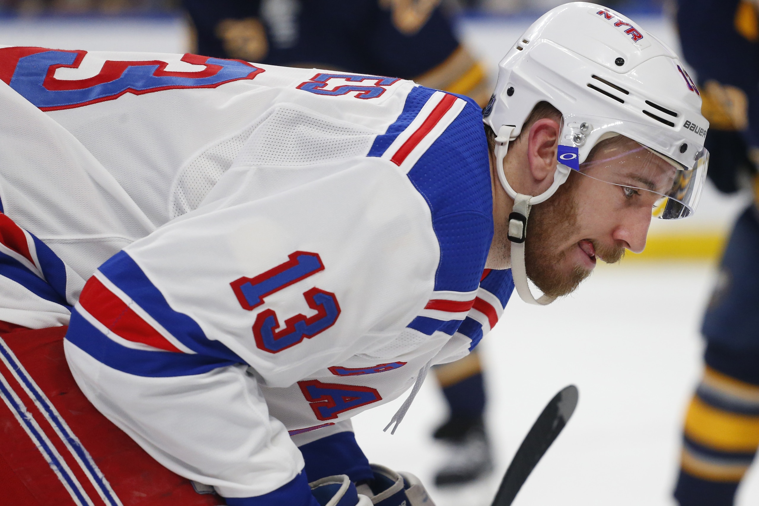 New York Rangers forward Kevin Hayes (13) lines up for a faceoff during the second period of an NHL hockey game against the Buffalo Sabres, Friday, Feb. 15, 2019, in Buffalo N.Y. (AP Photo/Jeffrey T. Barnes)