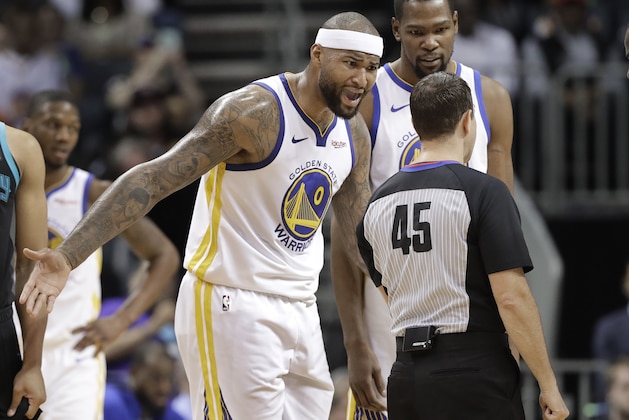 Golden State Warriors' DeMarcus Cousins (0) reacts to being called for a technical foul by referee Brian Forte (45) during the second half of an NBA basketball game against the Charlotte Hornets in Charlotte, N.C., Monday, Feb. 25, 2019. (AP Photo/Chuck Burton)