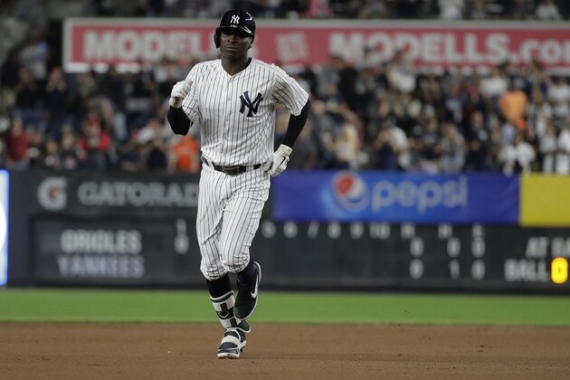 New York Yankees' Didi Gregorius celebrates as he runs the bases after hitting a home run during the first inning of a baseball game against the Baltimore Orioles Friday, Sept. 21, 2018, in New York. (AP Photo/Frank Franklin II)