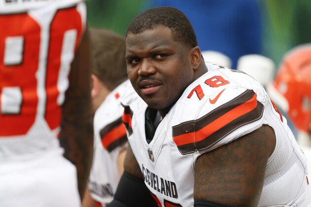 Cleveland Browns offensive tackle Greg Robinson sits on the sidelines in the second half of an NFL football game against the Cincinnati Bengals, Sunday, Nov. 25, 2018, in Cincinnati. (AP Photo/Gary Landers)