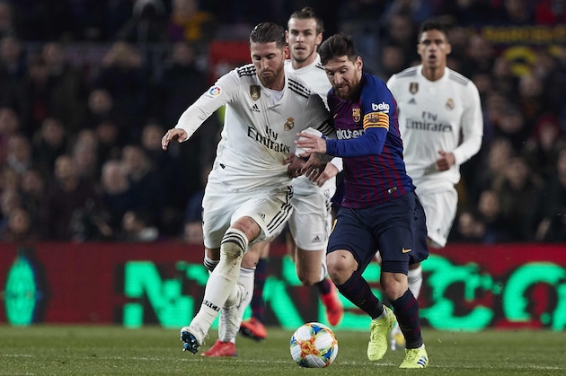BARCELONA, SPAIN - FEBRUARY 06: Lionel Messi of FC Barcelona competes for the ball with Sergio Ramos of Real Madrid during the Copa del Rey Semi Final first leg match between FC Barcelona and Real Madrid at Nou Camp on February 06, 2019 in Barcelona, Spain. (Photo by Quality Sport Images/Getty Images)