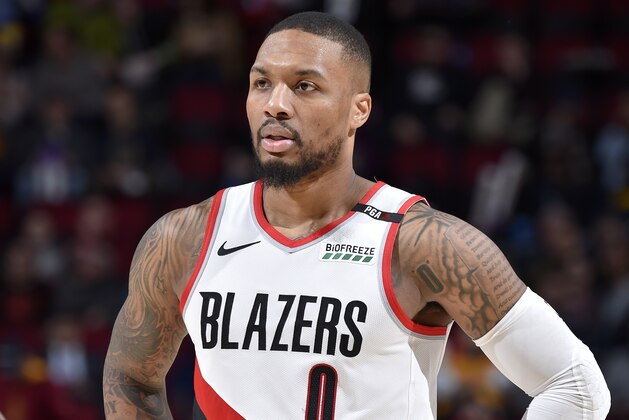 CLEVELAND, OH - FEBRUARY 25: Damian Lillard #0 of the Portland Trail Blazers looks on during the game against the Cleveland Cavaliers on February 25, 2019 at Quicken Loans Arena in Cleveland, Ohio. NOTE TO USER: User expressly acknowledges and agrees that, by downloading and/or using this photograph, user is consenting to the terms and conditions of the Getty Images License Agreement. Mandatory Copyright Notice: Copyright 2019 NBAE (Photo by David Liam Kyle/NBAE via Getty Images)