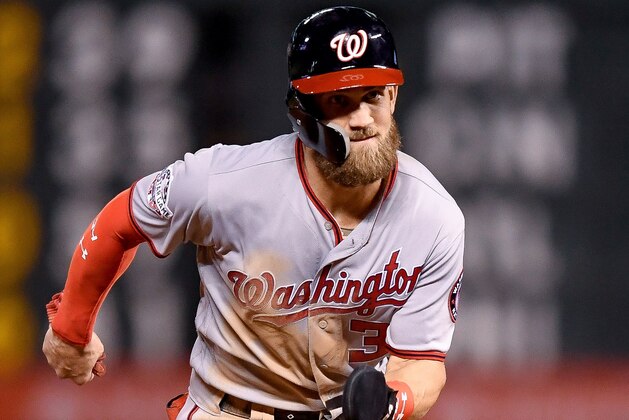 DENVER, CO - SEPTEMBER 29:  Bryce Harper #34 of the Washington Nationals advances to third base during a game against the Colorado Rockies at Coors Field on September 29, 2018 in Denver, Colorado.  (Photo by Dustin Bradford/Getty Images)