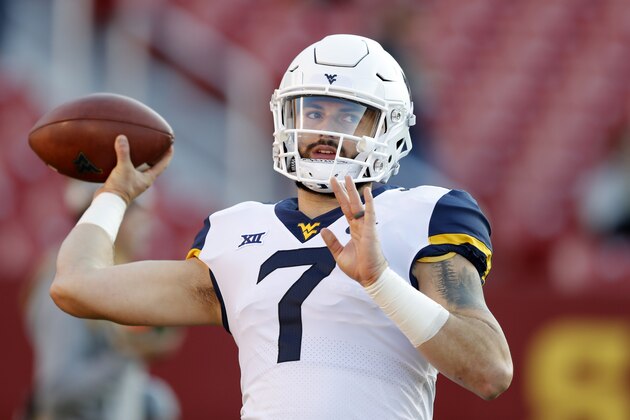 FILE - In this Saturday, Oct. 13, 2018 file photo, West Virginia quarterback Will Grier warms up before an NCAA college football game against Iowa State in Ames, Iowa. Grier has thrown 28 touchdown passes this season and will look for more when West Virginia plays TCU Saturday, Nov. 10, 2018, in Morgantown, W.Va.  (AP Photo/Charlie Neibergall, File)