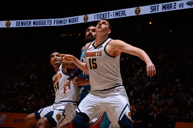 DENVER, CO - FEBRUARY 26: Nikola Jokic #15 of te Denver Nuggets defends Steven Adams #12 of the Oklahoma City Thunder  on February 26, 2019 at the Pepsi Center in Denver, Colorado. NOTE TO USER: User expressly acknowledges and agrees that, by downloading and/or using this Photograph, user is consenting to the terms and conditions of the Getty Images License Agreement. Mandatory Copyright Notice: Copyright 2019 NBAE (Photo by Bart Young/NBAE via Getty Images)
