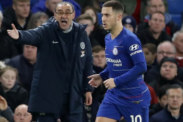 Chelsea's team manager Maurizio Sarri gives instructions to Chelsea's Eden Hazard, right, during the English Premier League soccer match between Chelsea and Leicester City at Stamford Bridge stadium in London, Saturday, Dec. 22, 2018.(AP Photo/Frank Augstein)