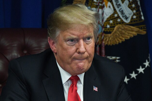 US President Donald Trump participates in a roundtable on the FIRST STEP Act in Gulfport, Mississippi on November 26, 2018. - President Trump has endorsed the FIRST STEP Act and has called on Congress to swiftly pass this bill to make our communities safer and our justice system fairer. This legislation has been endorsed by law enforcement organizations, faith leaders, and state officials like those in Mississippi who have seen the benefits of prison reform. (Photo by Jim WATSON / AFP)        (Photo credit should read JIM WATSON/AFP/Getty Images)