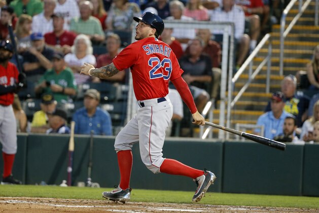 Boston Red Sox's Blake Swihart follows through on a swing against the Minnesota Twins during a spring training baseball game, Wednesday, March 16, 2016, in Fort Myers, Fla. (AP Photo/Tony Gutierrez)
