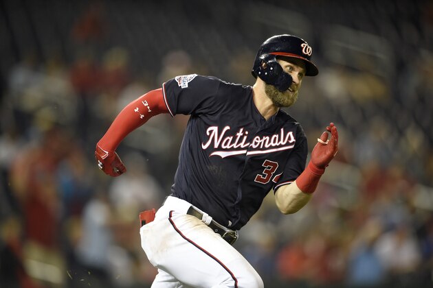 Washington Nationals' Bryce Harper runs towards first during a baseball game against the Philadelphia Phillies, Tuesday, Aug. 21, 2018, in Washington. (AP Photo/Nick Wass)