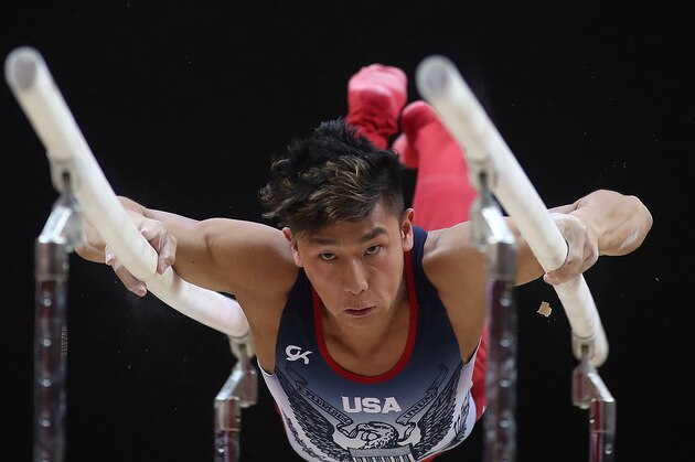 Yul Moldauer of the US competes in the Men's parallel bars during the Men's Team Final of the 2018 FIG Artistic Gymnastics Championships at Aspire Dome on October 29, 2018 in Doha. (Photo by KARIM JAAFAR / AFP)        (Photo credit should read KARIM JAAFAR/AFP/Getty Images)
