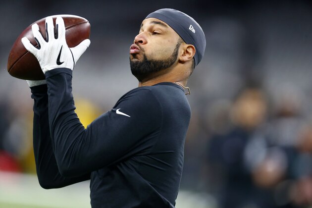 Philadelphia Eagles wide receiver Golden Tate (19) wars up before an NFL divisional playoff football game against the New Orleans Saints in New Orleans, Sunday, Jan. 13, 2019. (AP Photo/Butch Dill)