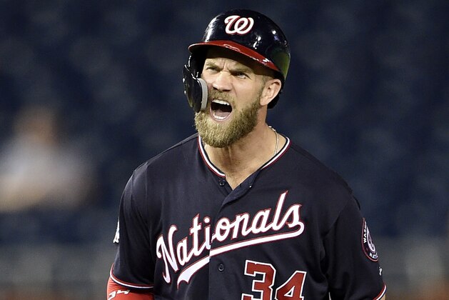 Washington Nationals' Bryce Harper reacts after his RBI-double during the sixth inning of a baseball game against the Philadelphia Phillies, Tuesday, Aug. 21, 2018, in Washington. (AP Photo/Nick Wass)