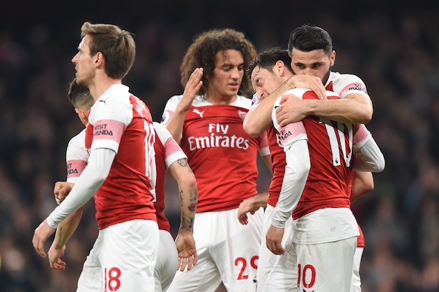 LONDON, ENGLAND - FEBRUARY 27: Mesut Ozil of Arsenal celebrates with teammate Sead Kolasinac after he provides the assist for his team's second goal during the Premier League match between Arsenal FC and AFC Bournemouth at Emirates Stadium on February 27, 2019 in London, United Kingdom. (Photo by Harriet Lander/Copa/Getty Images)
