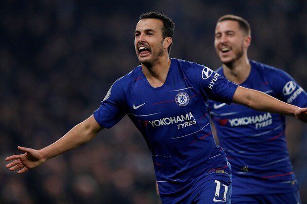 Chelsea's Spanish midfielder Pedro (L) celebrates scoring the opening goal with Chelsea's Belgian midfielder Eden Hazard during the English Premier League football match between Chelsea and Tottenham Hotspur at Stamford Bridge in London on February 27, 2019. (Photo by Adrian DENNIS / AFP) / RESTRICTED TO EDITORIAL USE. No use with unauthorized audio, video, data, fixture lists, club/league logos or 'live' services. Online in-match use limited to 120 images. An additional 40 images may be used in extra time. No video emulation. Social media in-match use limited to 120 images. An additional 40 images may be used in extra time. No use in betting publications, games or single club/league/player publications. /         (Photo credit should read ADRIAN DENNIS/AFP/Getty Images)