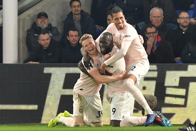 Manchester United's Belgian striker Romelu Lukaku (C) celebrates with teammates after scoring their second goal during the English Premier League football match between Crystal Palace and Manchester United at Selhurst Park in south London on February 27, 2019. (Photo by OLLY GREENWOOD / AFP) / RESTRICTED TO EDITORIAL USE. No use with unauthorized audio, video, data, fixture lists, club/league logos or 'live' services. Online in-match use limited to 120 images. An additional 40 images may be used in extra time. No video emulation. Social media in-match use limited to 120 images. An additional 40 images may be used in extra time. No use in betting publications, games or single club/league/player publications. /         (Photo credit should read OLLY GREENWOOD/AFP/Getty Images)