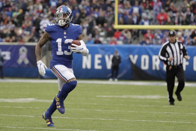 New York Giants' Odell Beckham runs with the ball during the first half of an NFL football game against the Tampa Bay Buccaneers, Sunday, Nov. 18, 2018, in East Rutherford, N.J. (AP Photo/Julio Cortez)