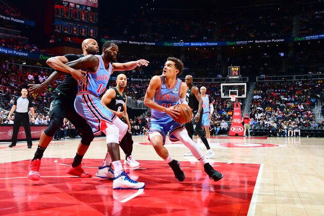 ATLANTA, GA - FEBRUARY 27: Trae Young #11 of the Atlanta Hawks drives to the basket against the Minnesota Timberwolves on February 27, 2019 at State Farm Arena in Atlanta, Georgia.  NOTE TO USER: User expressly acknowledges and agrees that, by downloading and/or using this Photograph, user is consenting to the terms and conditions of the Getty Images License Agreement. Mandatory Copyright Notice: Copyright 2019 NBAE (Photo by Scott Cunningham/NBAE via Getty Images)