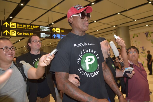 Retired American professional basketball player Dennis Rodman arrives at Changi International airport ahead of US-North Korea summit in Singapore on June 11, 2018. - North Korea's  Kim Jong Un and US President Donald Trump meet on June 12 for an unprecedented summit in an attempt to address the last festering legacy of the Cold War, with the US President calling it a 'one time shot' at peace. (Photo by ADEK BERRY / AFP)        (Photo credit should read ADEK BERRY/AFP/Getty Images)