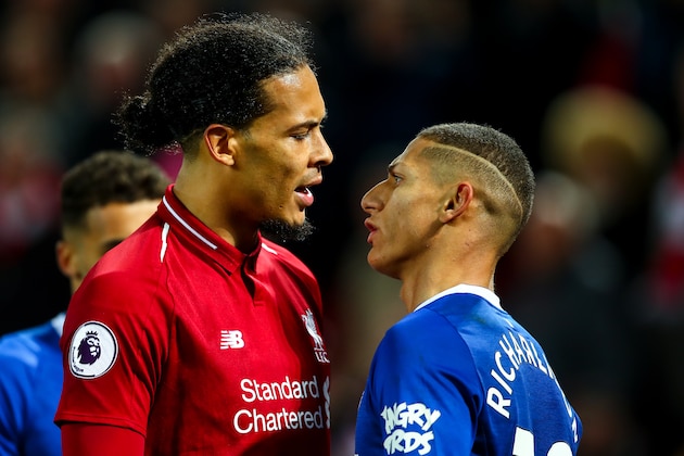 LIVERPOOL, ENGLAND - DECEMBER 02: Virgil van Dijk of Liverpool and Richarlison of Everton square up to each other  during the Premier League match between Liverpool FC and Everton FC at Anfield on December 2, 2018 in Liverpool, United Kingdom. (Photo by Robbie Jay Barratt - AMA/Getty Images)