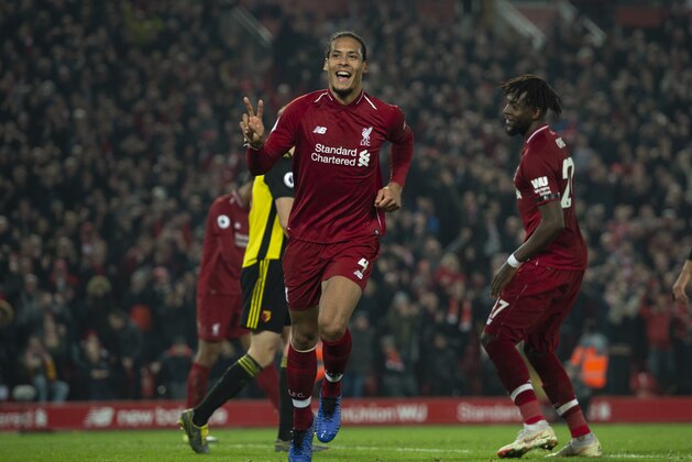 LIVERPOOL, ENGLAND - FEBRUARY 27: Virgil van Dijk of Liverpool celebrates scoring his second goal during the Premier League match between Liverpool FC and Watford FC at Anfield on February 27, 2019 in Liverpool, United Kingdom. (Photo by Visionhaus/Getty Images)