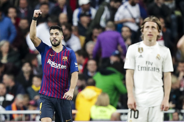MADRID, SPAIN - FEBRUARY 27: (L-R) Luis Suarez of FC Barcelona, Luka Modric of Real Madrid during the Spanish Copa del Rey  match between Real Madrid v FC Barcelona at the Santiago Bernabeu on February 27, 2019 in Madrid Spain (Photo by David S. Bustamante/Soccrates/Getty Images)