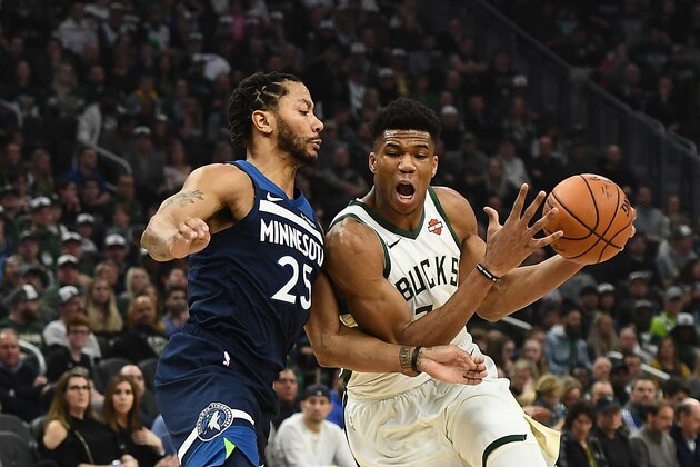 MILWAUKEE, WISCONSIN - FEBRUARY 23:  Giannis Antetokounmpo #34 of the Milwaukee Bucks is defended by Derrick Rose #25 of the Minnesota Timberwolves during a game at Fiserv Forum on February 23, 2019 in Milwaukee, Wisconsin. NOTE TO USER: User expressly acknowledges and agrees that, by downloading and or using this photograph, User is consenting to the terms and conditions of the Getty Images License Agreement. (Photo by Stacy Revere/Getty Images)