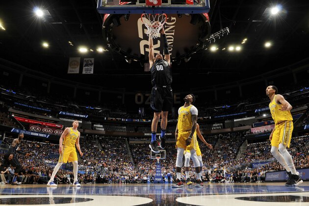 ORLANDO, FL - FEBRUARY 28: Aaron Gordon #00 of the Orlando Magic dunks the ball  during the game against Jordan Bell #2 of the Golden State Warriors on February 28, 2019 at Amway Center in Orlando, Florida. NOTE TO USER: User expressly acknowledges and agrees that, by downloading and or using this photograph, User is consenting to the terms and conditions of the Getty Images License Agreement. Mandatory Copyright Notice: Copyright 2019 NBAE (Photo by Fernando Medina/NBAE via Getty Images)