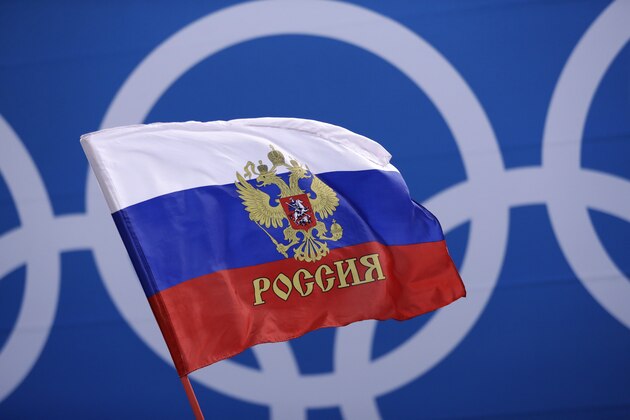 A Russian supporter waves a flag before the preliminary round of the men's hockey game between the team from Russia and the United States at the 2018 Winter Olympics in Gangneung, South Korea, Saturday, Feb. 17, 2018. (AP Photo/Matt Slocum)