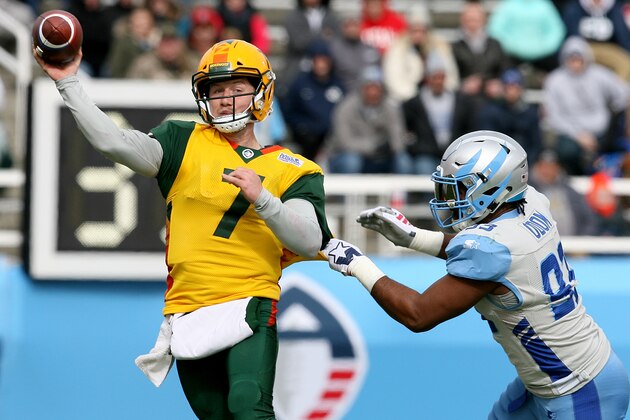 SALT LAKE CITY, UT - FEBRUARY 23: John Wolford #7 of Arizona Hotshots attempts a pass as Chris Odom #93 of Salt Lake Stallions grabs him during their Alliance of American Football game at Rice Eccles Stadium on February 23, 2019 in Salt Lake City, Utah. (Photo by Chris Gardner/AAF/Getty Images)