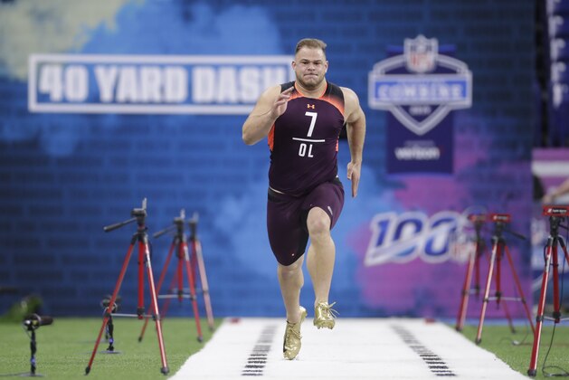 NC State offensive lineman Garrett Bradbury runs the 40-yard dash at the NFL football scouting combine in Indianapolis, Friday, March 1, 2019. (AP Photo/Michael Conroy)
