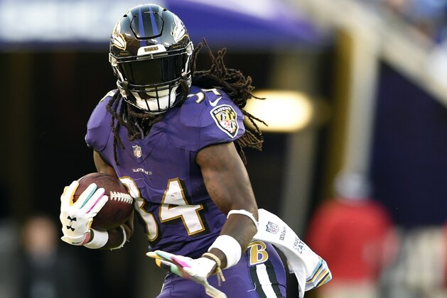Baltimore Ravens running back Alex Collins rushes the ball in the second half of an NFL football game against the New Orleans Saints, Sunday, Oct. 21, 2018, in Baltimore. (AP Photo/Gail Burton)