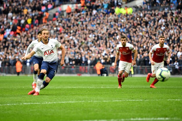 LONDON, ENGLAND - MARCH 02: Harry Kane of Tottenham Hotspur scores his team's first goal from the penalty spot during the Premier League match between Tottenham Hotspur and Arsenal FC at Wembley Stadium on March 02, 2019 in London, United Kingdom. (Photo by Michael Regan/Getty Images)