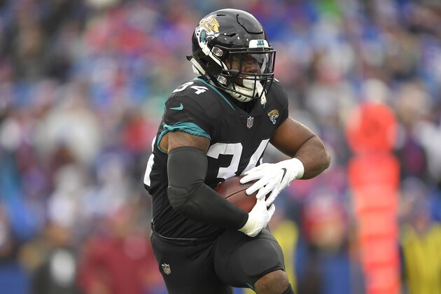 Jacksonville Jaguars running back Carlos Hyde runs with the ball against the Buffalo Bills during the second half of an NFL football game, Sunday, Nov. 25, 2018, in Orchard Park, N.Y. (AP Photo/Adrian Kraus)