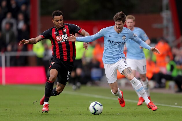 BOURNEMOUTH, ENGLAND - MARCH 02: John Stones of Manchester City battles for possession with Joshua King of AFC Bournemouth during the Premier League match between AFC Bournemouth and Manchester City at Vitality Stadium on March 02, 2019 in Bournemouth, United Kingdom. (Photo by Richard Heathcote/Getty Images)