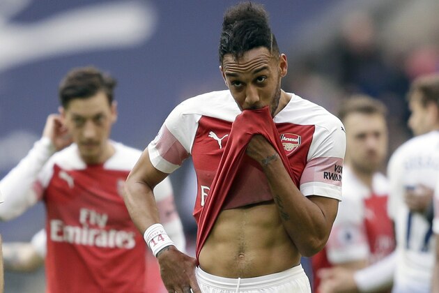 Arsenal's Pierre-Emerick Aubameyang leaves the field at the end of the English Premier League soccer match between Tottenham Hotspur and Arsenal at Wembley stadium in London, Saturday, March 2, 2019. (AP Photo/Tim Ireland)