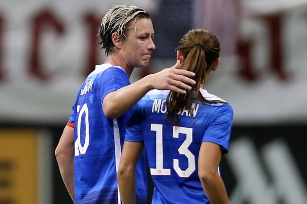 NEW ORLEANS, LA - DECEMBER 16:  Abby Wambach #20 walks off the field with Alex Morgan #13 of United States after Morgan was injured against during the game against China at Mercedes-Benz Superdome on December 16, 2015 in New Orleans, Louisiana.  (Photo by Chris Graythen/Getty Images)