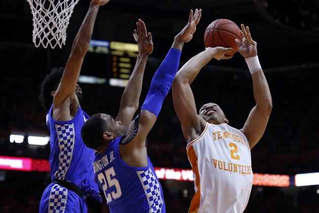 Tennessee forward Grant Williams (2) shoots as as Kentucky forward PJ Washington (25) and forward Nick Richards (4) defend during the first half of an NCAA college basketball game Saturday, March 2, 2019, in Knoxville, Tenn. (AP Photo/Wade Payne)
