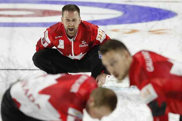 Canada skip Brad Gushue directs sweepers during a qualification game against the United States during the World Men's Curling Championship, Saturday, April 7, 2018, in Las Vegas. (AP Photo/John Locher)