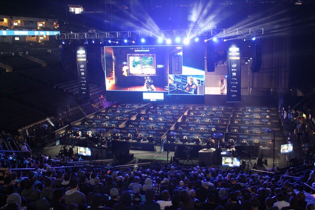 Fans watch as 80 players simultaneously fight for survival in an eSports match of upstart computer game PlayUnknown's Battlegrounds at an Intel Extreme Masters tournament in the Oracle Arena in Oakland, California on November 18, 2017.
Scores of virtual warriors faced-off in a Hunger Games-style death match here in a massive, real-world eSports match-up of upstart shooter game 'PlayerUnknown's Battlegrounds.' The computer game's rise has been epic, with some industry trackers branding this the year of 'PUBG' even though it is technically still in trial mode with a final version yet to be released.In a colossal  two-day event that ended late Sunday, 80 players hunched over computers in a warren of cubicles set up in an arena where the champion Golden State Warriors usually play home basketball games.
 / AFP PHOTO / Glenn CHAPMAN        (Photo credit should read GLENN CHAPMAN/AFP/Getty Images)