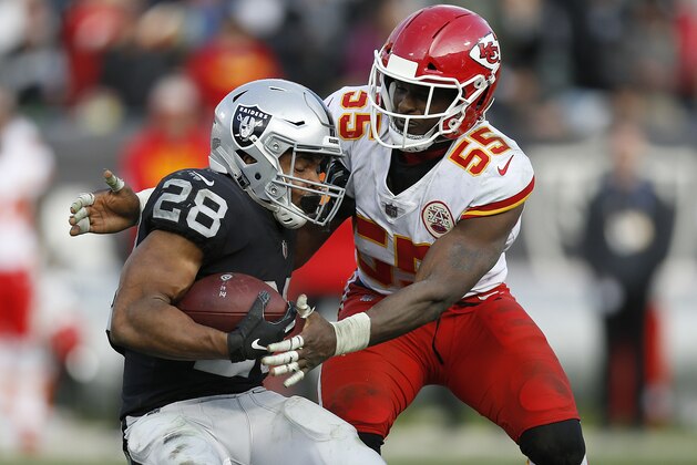Kansas City Chiefs linebacker Dee Ford (55) tackles Oakland Raiders running back Doug Martin (28) during the second half of an NFL football game in Oakland, Calif., Sunday, Dec. 2, 2018. (AP Photo/D. Ross Cameron)