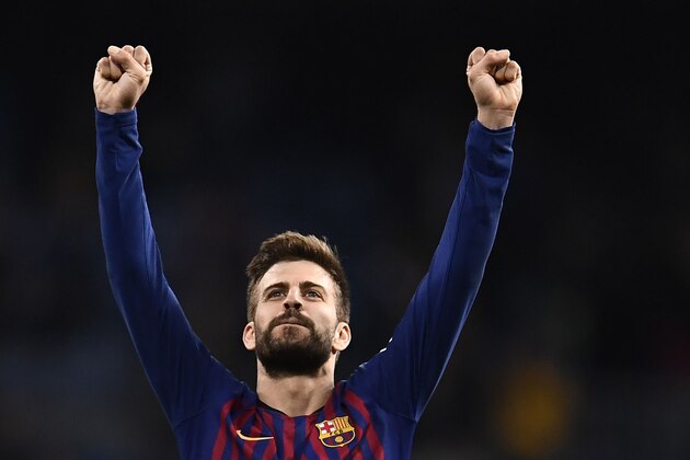 Barcelona's Spanish defender Gerard Pique celebrates their win at the end of the Spanish league football match between Real Madrid CF and FC Barcelona at the Santiago Bernabeu stadium in Madrid on March 2, 2019. (Photo by OSCAR DEL POZO / AFP)        (Photo credit should read OSCAR DEL POZO/AFP/Getty Images)