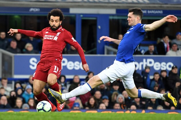 LIVERPOOL, ENGLAND - MARCH 03:  Mohamed Salah of Liverpool is tackled by Michael Keane of Everton during the Premier League match between Everton FC and Liverpool FC at Goodison Park on March 03, 2019 in Liverpool, United Kingdom. (Photo by Michael Regan/Getty Images)