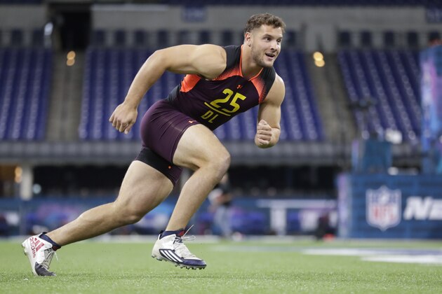Ohio State defensive lineman Nick Bosa runs a drill at the NFL football scouting combine in Indianapolis, Sunday, March 3, 2019. (AP Photo/Michael Conroy)