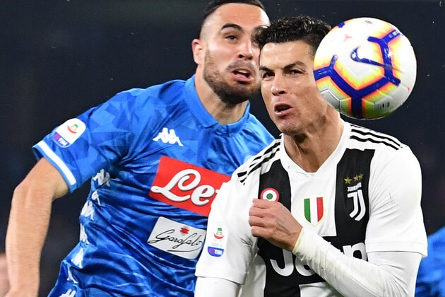Juventus' Portuguese forward Cristiano Ronaldo (R) fights for the ball with Napoli's Serbian defender Nikola Maksimovic during the Italian Serie A football match between Napoli and Juventus on March 3, 2019, at the San Paolo Stadium in Naples. (Photo by Alberto PIZZOLI / AFP)        (Photo credit should read ALBERTO PIZZOLI/AFP/Getty Images)