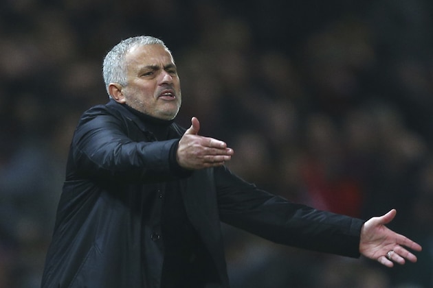 FILE - In this Wednesday Dec. 5, 2018 file photo Manchester United's coach Jose Mourinho gives directions to his players during the English Premier League soccer match between Manchester United and Arsenal at Old Trafford stadium in Manchester, England. Manchester United says Jose Mourinho has left the Premier League club with immediate effect. The decision was announced Tuesday Dec.18, 2018, two days after a 3-1 loss to Liverpool left United 19 points off the top of the Premier League after 17 games. (AP Photo/Dave Thompson, File)